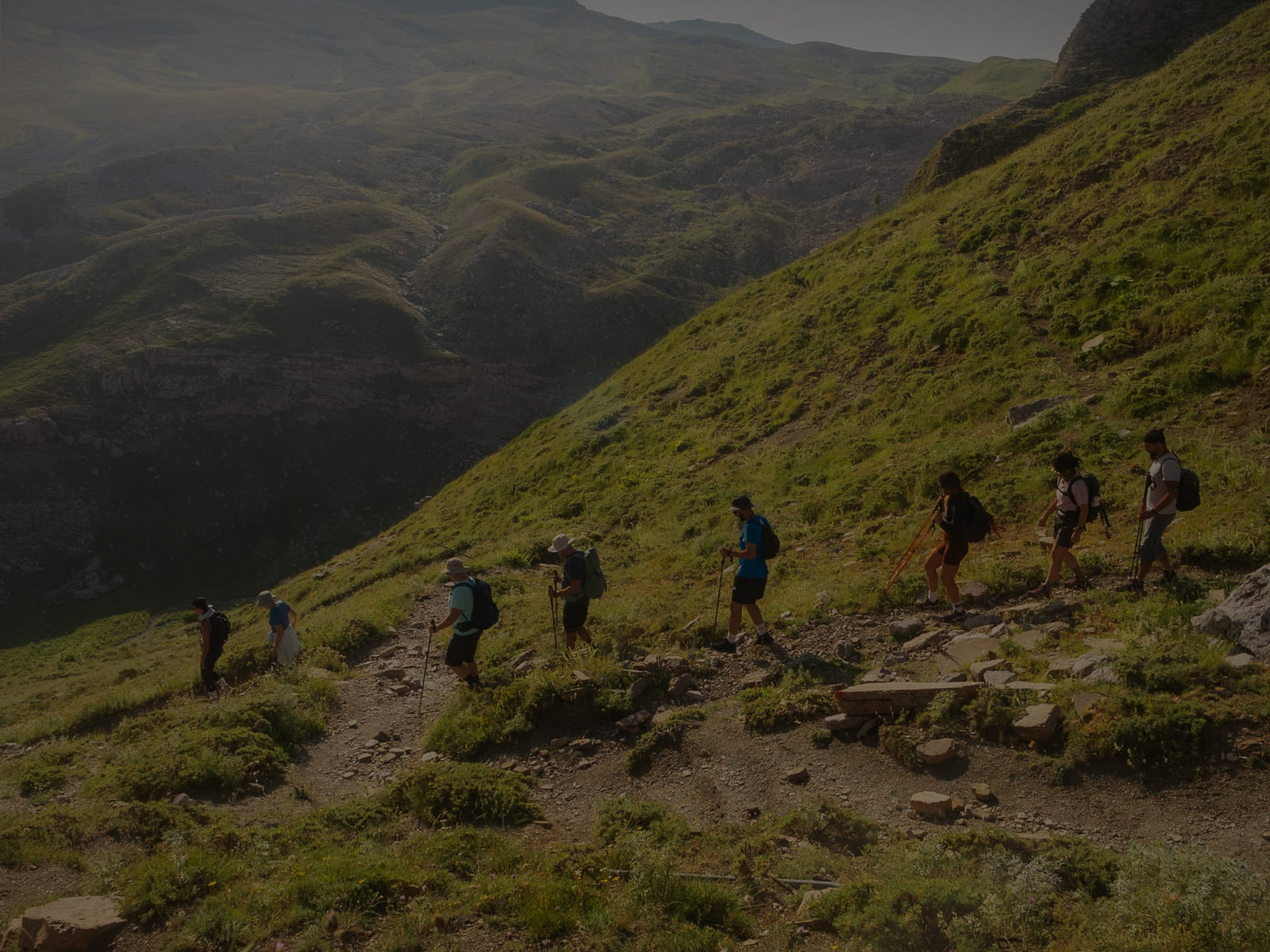 Hikers on a mountain trail above the forested Valia Calda valley in the Pindos, northern Greece